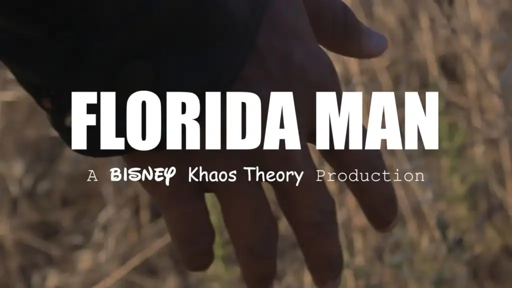 Close-up of a hand with a blurred outdoor background, emphasizing Florida Man theme.